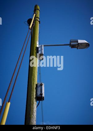 Modern street light on wooden pole UK Stock Photo