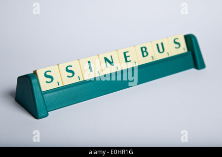 Scrabble tiles mixed up making the word business Stock Photo