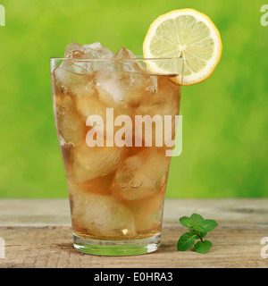 Ice tea with ice cubes and a lemon slice Stock Photo