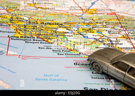 Model sedan on a map of Los Angeles California.