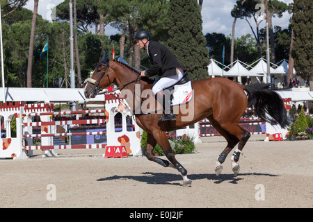 Robert Smith on Voila at the Piazza di Siena show jumping event in Rome in May 2013 Stock Photo