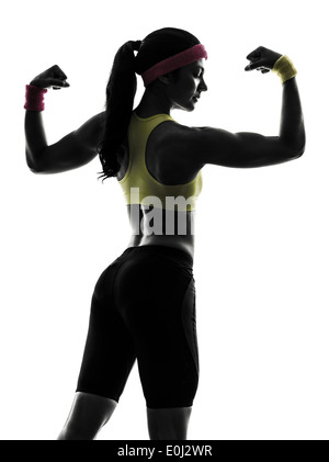 one woman exercising fitness flexing muscles rear view in silhouette on white background Stock Photo