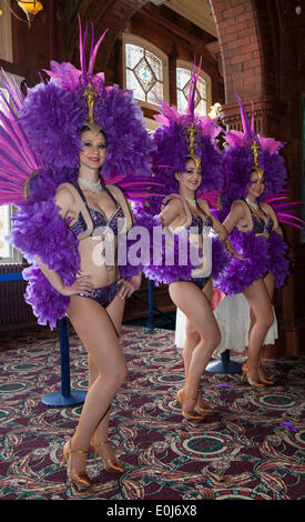 Blackpool, Lancashire, UK, 14th May 2014. Showgirls at one of UK’s most iconic attractions, The Blackpool Tower, a tourist attraction in Blackpool, Lancashire in England was opened to the public on 14 May 1894, turned a staggering 120 years old this year. It rises to 158 metres (518 feet) and is a Grade I listed building. When The Blackpool Tower opened in 1894 tickets were just 6p per person! So as part of this 120th Birthday celebrations Eye tickets were sold for JUST 6p. Credit:  Conrad Elias/Alamy Live News Stock Photo