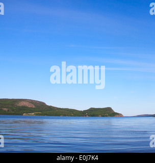 View on Norwegian fjord and mountain range at sunny day Stock Photo