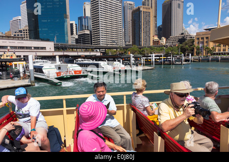 Sydney Australia,Circular Quay,Sydney Ferries,Harbour,harbor,ferry,upper deck,riders,passenger passengers rider riders,Asian man men male,woman female Stock Photo