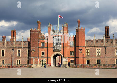 Hampton Court, England, UK. 14th May 2014. It was a warm and sunny day across the UK. Here the Union Flag flies proudly over Hampton Court Palace a popular tourist attraction in South West London. Credit:  Julia Gavin/Alamy Live News Stock Photo