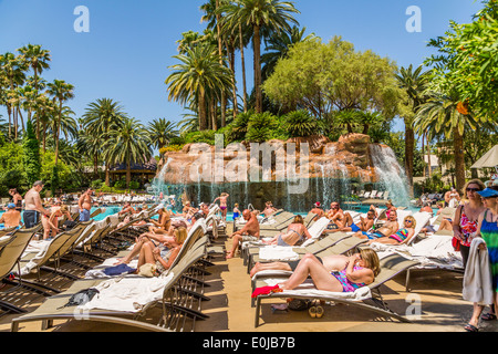 People relaxing and sunbathing poolside at the Mandalay Bay Hotel Las Vegas Nevada USA Stock Photo