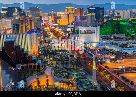 An elevated panoramic landscape view of The Las Vegas strip at dusk with the Luxor Hotel in the foreground, Las Vegas, Nevada USA Stock Photo