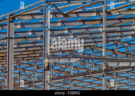 Building steel structure metal frame girders and roofing section closeup photo detail. Stock Photo