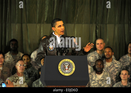 BAGRAM AIRFIELD, Afghanistan – The President of the United States Barack Obama thanks a crowd of deployed servicemembers and Stock Photo