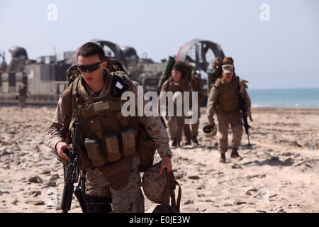 Marines and sailors from Combat Logistics Battalion 22, 22nd Marine Expeditionary Unit debark a landing craft air cushioned wit gistics Combat Element, Combat Logistics Battalion 22; a Ground Combat Element, Battalion Landing Team, 2nd Battalion, 2nd Marine Regiment; and its Command Element. Stock Photo