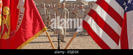 Marines and sailors with 2nd Battalion, 9th Marines salute a memorial display honoring Lance Cpl. Dakota R. Huse, a rifleman wi Stock Photo