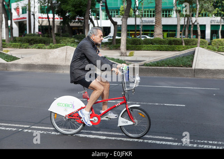 Mature man riding an Ecobici along Paseo De La Reforma on Car free Sunday Stock Photo