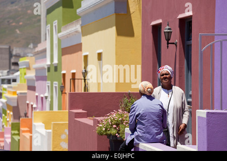 local woman and their typical coloured homes in the quarter Cape Malay Bo-Kaap, Cape Town, Western Cape, South Africa Stock Photo