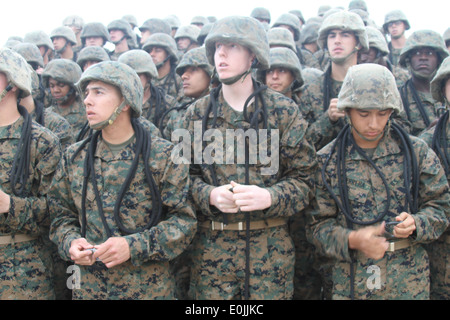 Recruits from Company C, 2nd Recruit Training Battalion, listen and apply what their instructor tells them to do with their gea Stock Photo