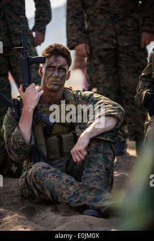 U.S. Marine Corps Cpl. Justin Federhofer, sits during a safety brief prior the start of the rehearsal for the combined amphibio Stock Photo