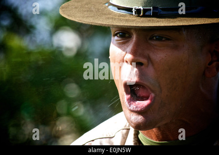 A drill instructor from Marine Corps Recruiting Station Fort Lauderdale corrects a future Marine during the annual field meet A Stock Photo