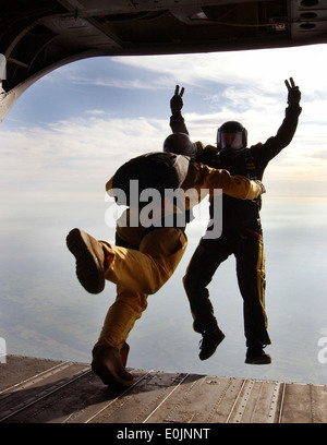 Two members of the United States Military Academy 'Black Knights' parachute team, leap from a Chinook Ch-47 belonging to the Ne Stock Photo