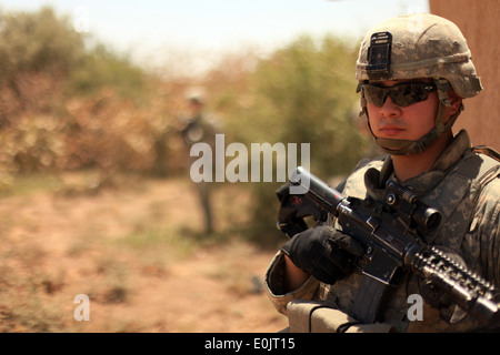 U.S. Army Pfc. Eloy Martinez, from Dallas, Texas, assigned to the 1st Battalion, 8th Cavalry Regiment, 2nd Brigade Combat Team, Stock Photo