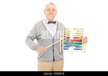Mature teacher pointing with a stick on an abacus Stock Photo