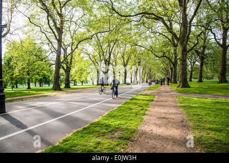 Hyde Park, Cycling on Broad Walk, London London, UK Stock Photo