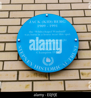 Commemorative plaque in Cable Street, East London, records the birthplace of the boxer Jack (Kid) Berg, the Whitechapel Windmill Stock Photo