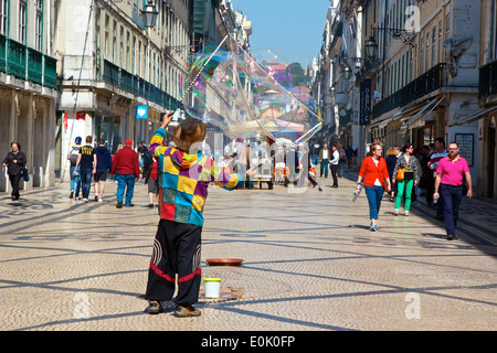 Street entertainer blowing giant soap bubbles in Rua Augusta Lisbon Portugal western Europe Stock Photo