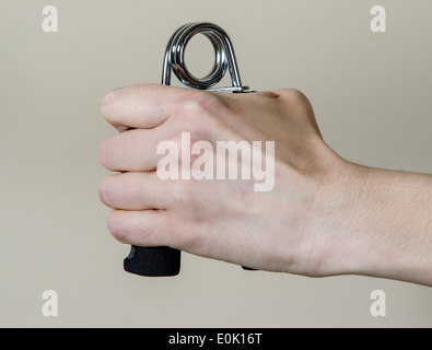 Closeup of female squeezing hand springs Stock Photo - Alamy