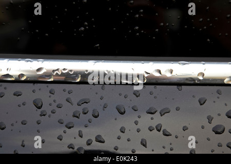 9478. Raindrops on car, Kent Stock Photo