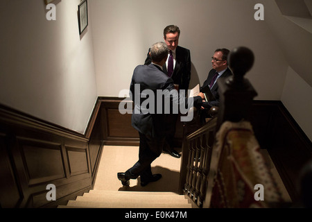 US President Barack Obama talks with British Prime Minister David Cameron following a G7 Leaders Meeting to discuss the situation in Ukraine, at the Prime Minister's residence March 24, 2014 in The Hague, Netherlands. Stock Photo