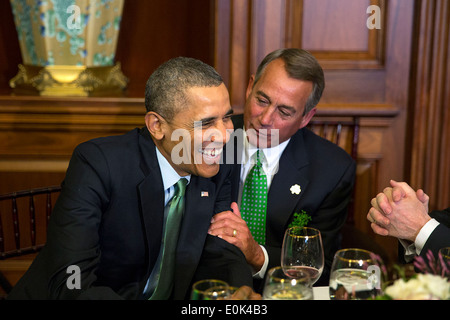 US President Barack Obama shares a laugh with House Speaker John Boehner during the annual St. Patrick’s Day lunch with Prime Minister Enda Kenny of Ireland at the U.S. Capitol March 14, 2014 in Washington, DC. Stock Photo