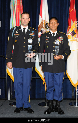 Noncommissioned Officer of the Year Staff Sgt. Matthew Senna and Soldier of the Year Sgt. Saral Shretha pose for a photo togeth Stock Photo