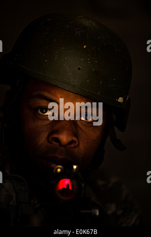 Senior Airman Herbert Nieves guards the entrance of a building after it was cleared during a Combat Leadership Course Training Stock Photo