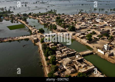 An aerial view of a town surrounded by flood water as U.S. Marine Pilots from the 26th Marine Expeditionary Unit begin their la Stock Photo