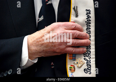 A survivor of the Dec. 7, 1941, Japanese attack on Pearl Harbor holds his cover over his heart during a Pearl Harbor Day ceremo Stock Photo