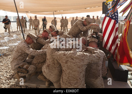 Marines from Cpl. Joshua Dumaw’s platoon gather for a final prayer in front of his memorial stand, July 11. Dumaw, a squad le Stock Photo