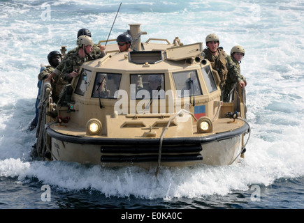 A lighter amphibious resupply cargo vehicle assigned to Beach Master Unit 1 at Naval Base Coronado approaches the amphibious as Stock Photo