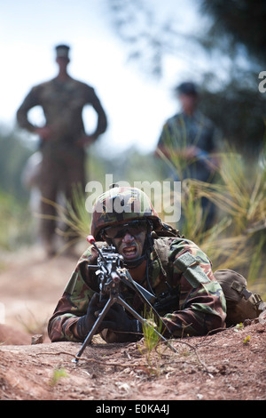 Soldier and machine gun Stock Photo