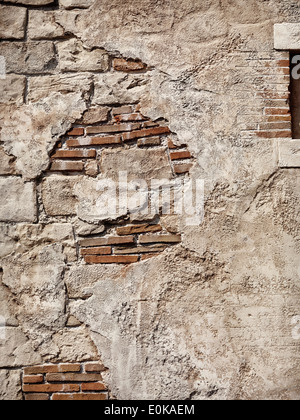 Old rustic stone and brick wall, grungy texture background Stock Photo