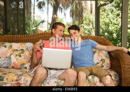 Father and son using a portable computer Stock Photo