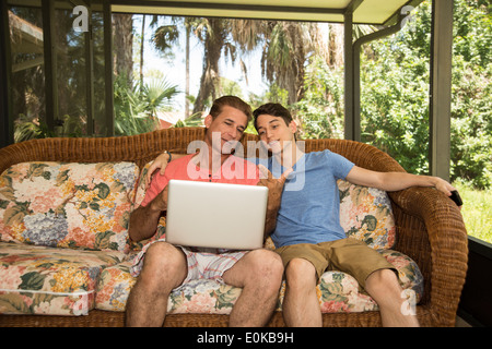Father and son using a portable computer Stock Photo