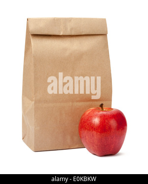 Brown Bag Lunch with a red apple, isolated on a white background. Stock Photo