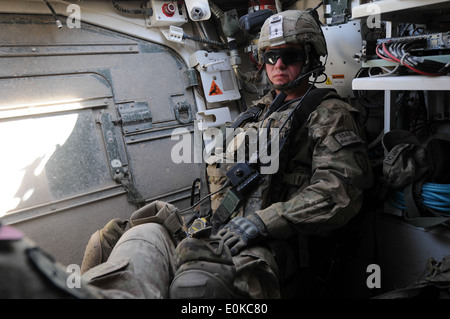 Cpl. Corey Buffington with the 1st Stryker Brigade Combat Team, 25th Infantry Division sits in the rear of a Stryker vehicle. Stock Photo