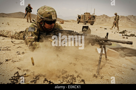 Air Force Master Sgt. Jeffery Needham, staff platoon sergeant attached to Laghman Provincial Reconstruction Team, fires his MK- Stock Photo