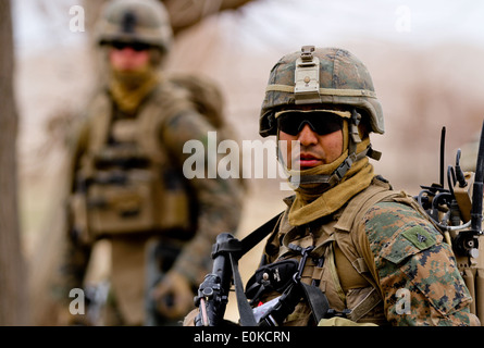 Cpl. Manuel Ortiz, a team leader with 3rd Platoon, Lima Company, patrols through Sangin, Feb. 26. 2012. Ortiz, currently deploy Stock Photo