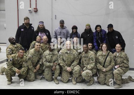 USO Tour celebrities pose for group photos at the end of the Holiday