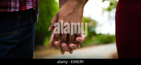 Interracial Couple Holding Hands Stock Photo