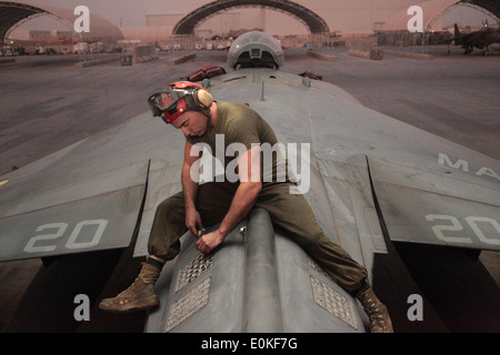 Cpl. Michael Garetz, a Marine Attack Squadron 513 ordnance technician and Comstock, Texas, native, inspects flares loaded aboar Stock Photo