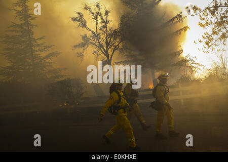 San Marcos, California, USA. 14th May, 2014. Nearby residents use fire ...