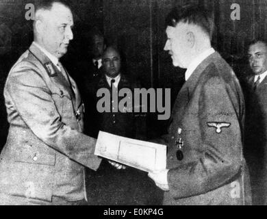 Two German workers shaking hands, a 1930s symbol of German stregth ...